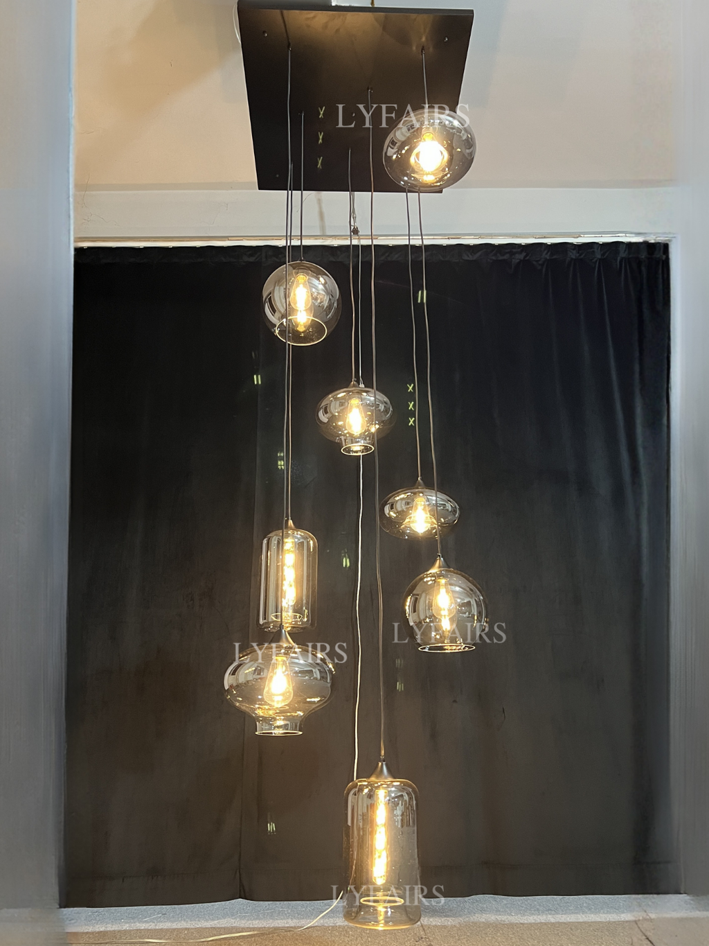 https://cdn.shopify.com/s/files/1/0554/8562/8591/files/LYFAIRSModernSmokeGrayGlassPendantLightFixtureChandelier.png?v=1766650593