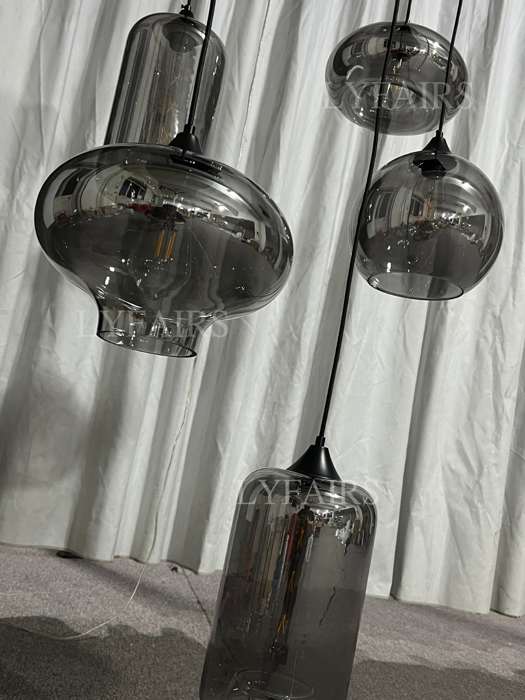https://cdn.shopify.com/s/files/1/0554/8562/8591/files/LYFAIRSModernSmokeGrayGlassPendantLightFixtureChandelier_3.png?v=1766650593