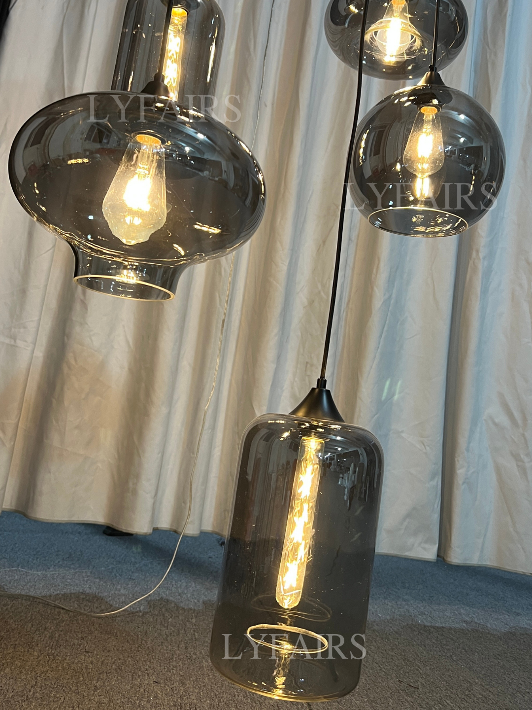 https://cdn.shopify.com/s/files/1/0554/8562/8591/files/LYFAIRSModernSmokeGrayGlassPendantLightFixtureChandelier_4.png?v=1766650593