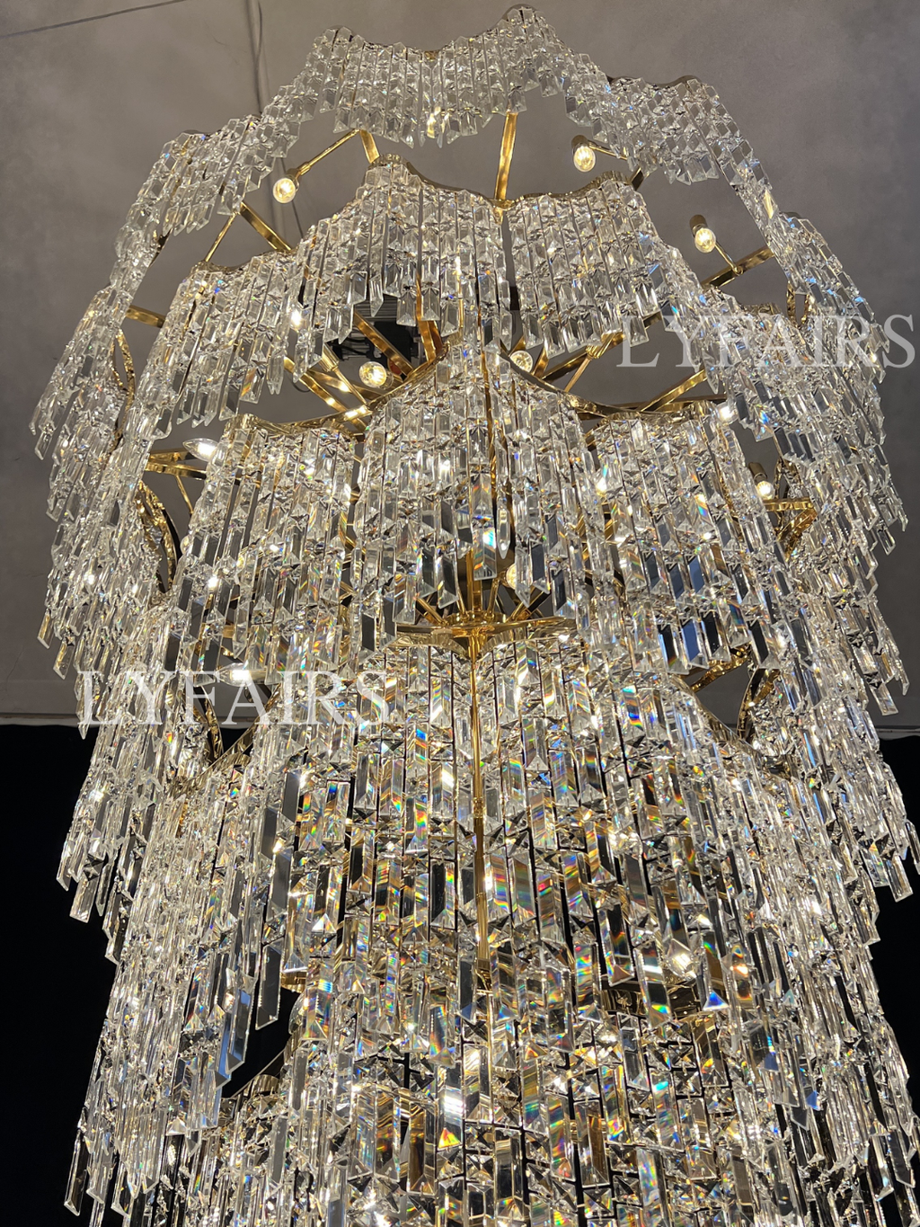 https://cdn.shopify.com/s/files/1/0554/8562/8591/files/LYFAIRSOversizedEuropeanMulti-layersGoldenLuxuryCrystalChandelierVillaHigh-ceilingFoyer_4.png?v=1775719722