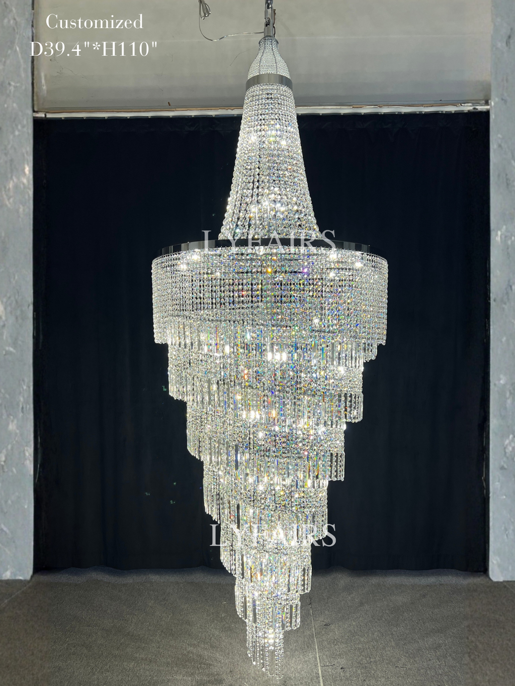 https://cdn.shopify.com/s/files/1/0554/8562/8591/files/LYFAIRS_ModernCrystalTasselChandelierforFoyerStaircase.png?v=1775619528