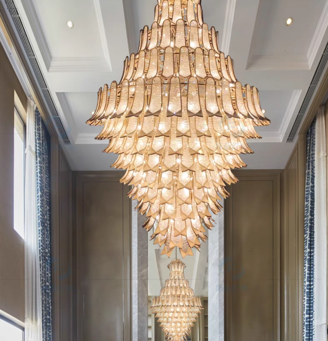https://cdn.shopify.com/s/files/1/0736/8795/7790/files/extra-large-luxury-multi-tier-gold-crystalchandelier-for-stairslarge-high-ceiling-room-merlin-lamps-6.png?v=1765406239