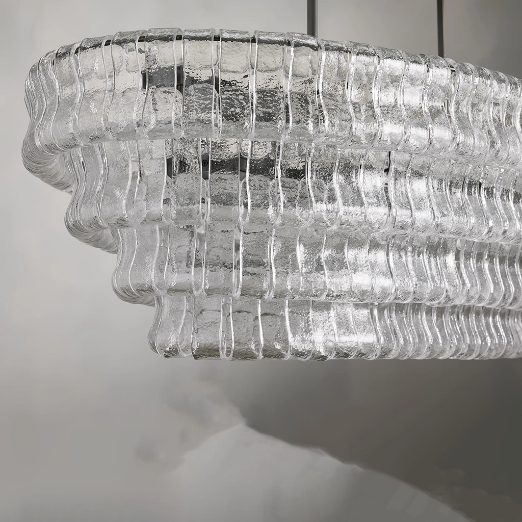 https://cdn.shopify.com/s/files/1/0736/8795/7790/files/ghiaccio-glass-oval-chandelier-5465-merlin-lamps-5.png?v=1765380220
