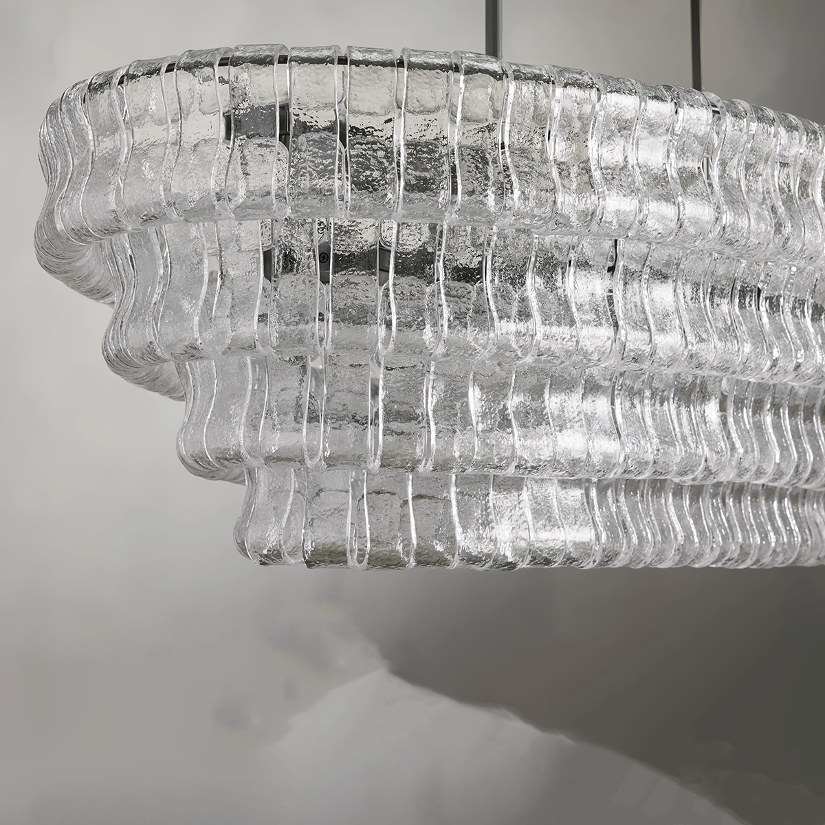 https://cdn.shopify.com/s/files/1/0736/8795/7790/files/ghiaccio-glass-oval-chandelier-5465-merlin-lamps-5.png?v=1765380220