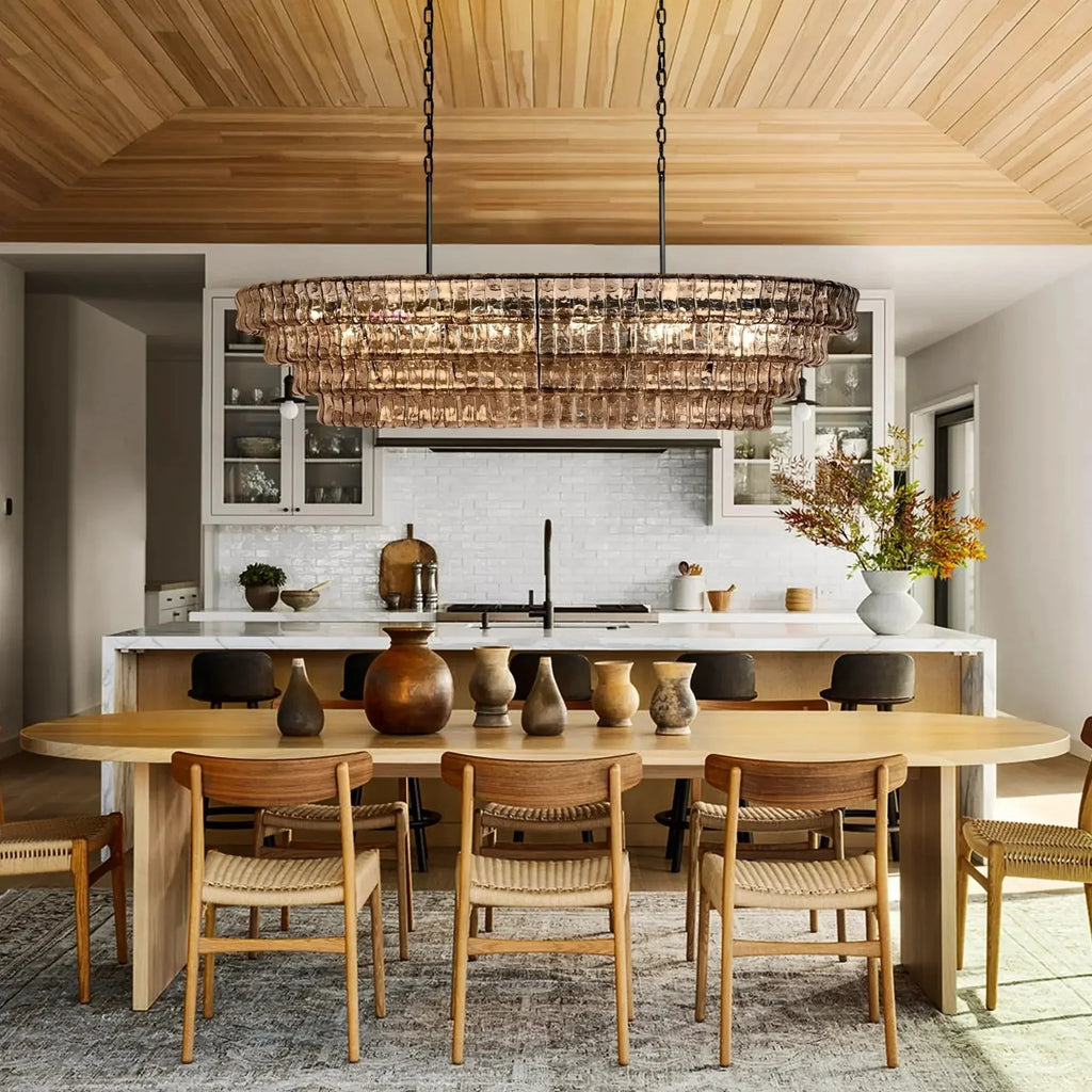 https://cdn.shopify.com/s/files/1/0736/8795/7790/files/ghiaccio-glass-oval-chandelier-5465-merlin-lamps.webp?v=1765380211
