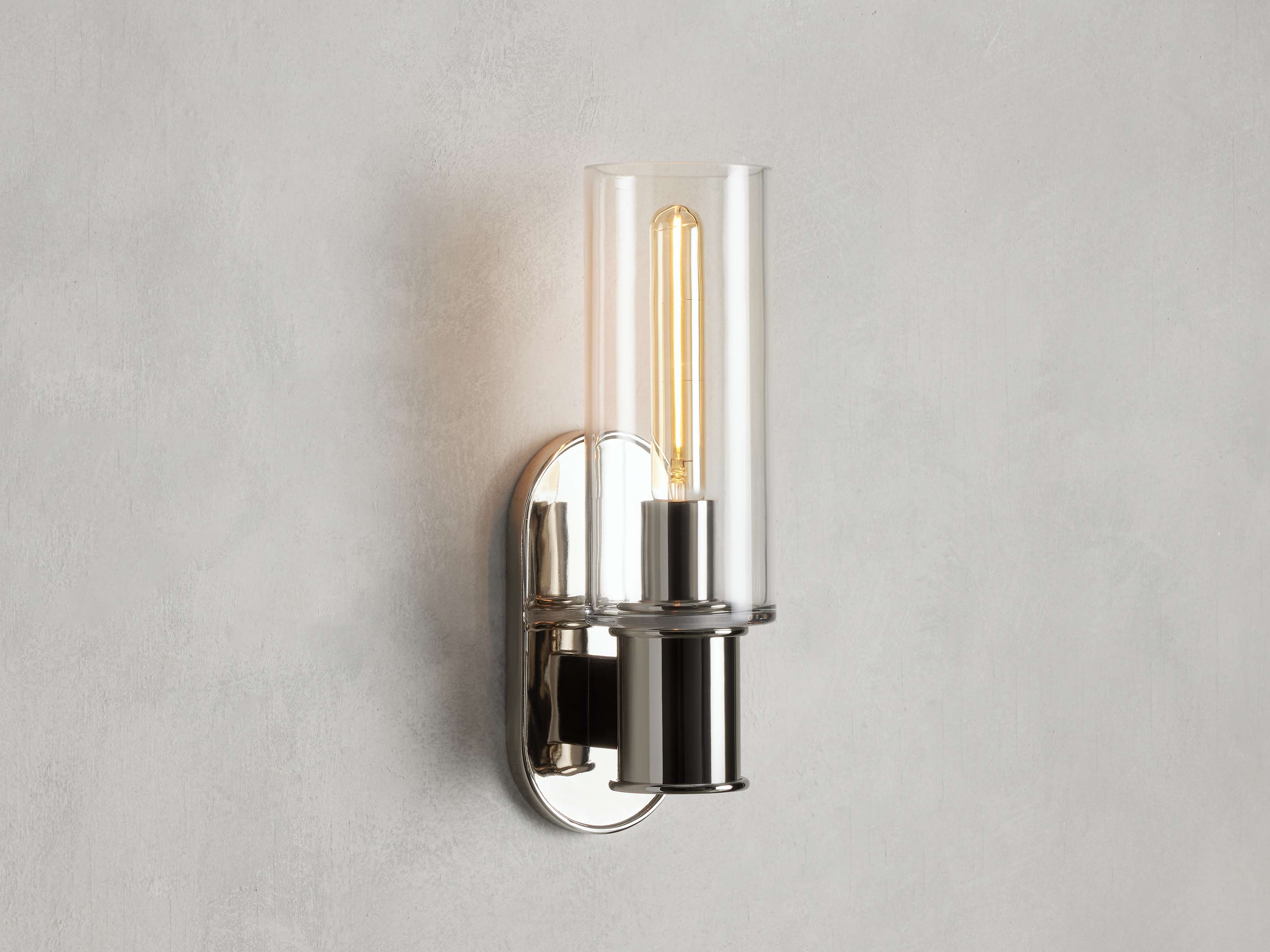 https://cdn.shopify.com/s/files/1/0736/8795/7790/files/harlin-wall-sconce-in-clear-merlin-lamps.jpg?v=1765382025