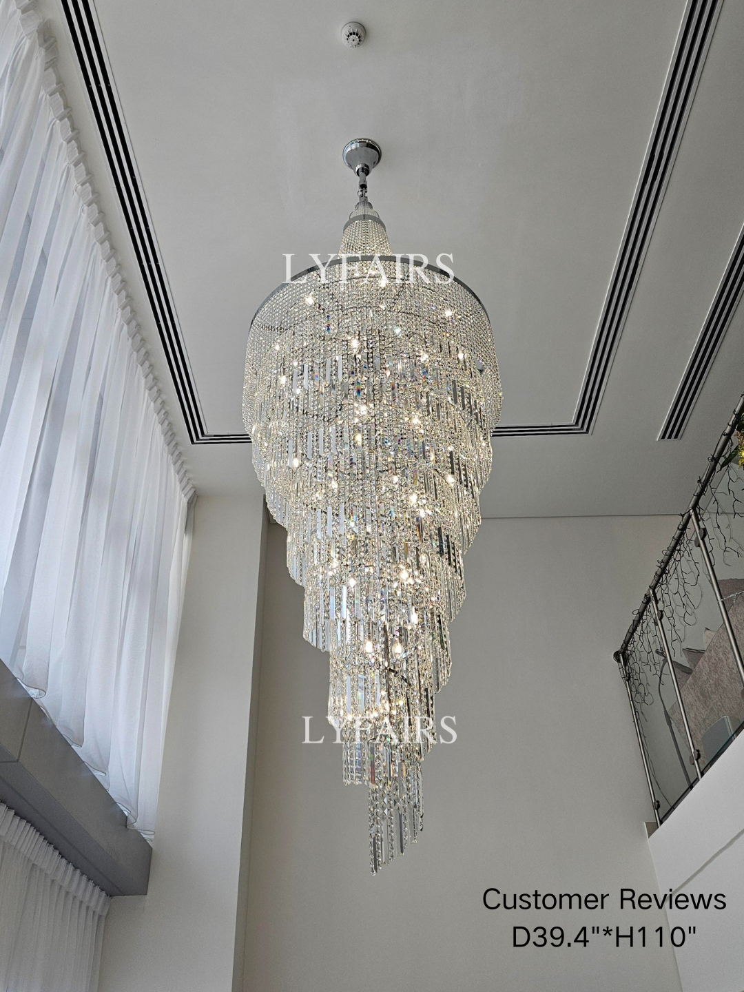 https://cdn.shopify.com/s/files/1/0554/8562/8591/files/lyfairs-ModernCrystalTasselChandelierforFoyerStaircase.png?v=1767603858