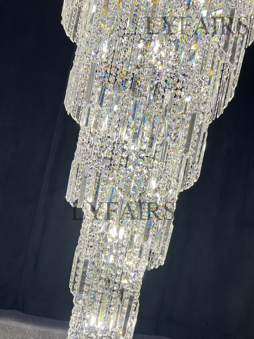 https://cdn.shopify.com/s/files/1/0554/8562/8591/files/lyfairsModernCrystalTasselChandelierforFoyerStaircase_7.png?v=1775619528