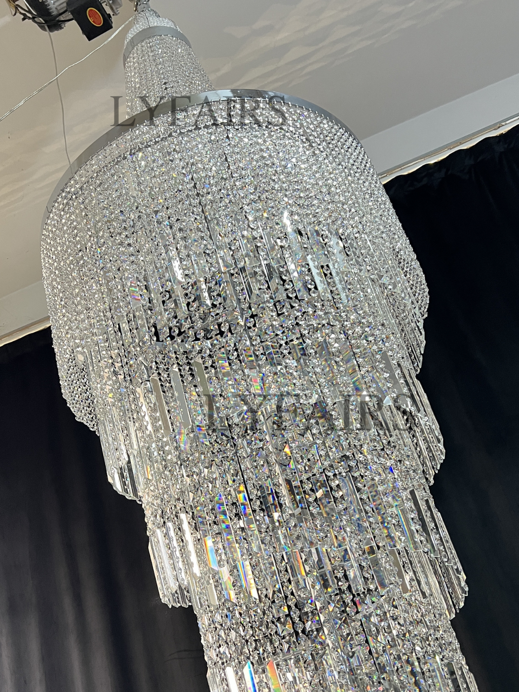 https://cdn.shopify.com/s/files/1/0554/8562/8591/files/lyfairsModernCrystalTasselChandelierforFoyerStaircase_8.png?v=1775619528
