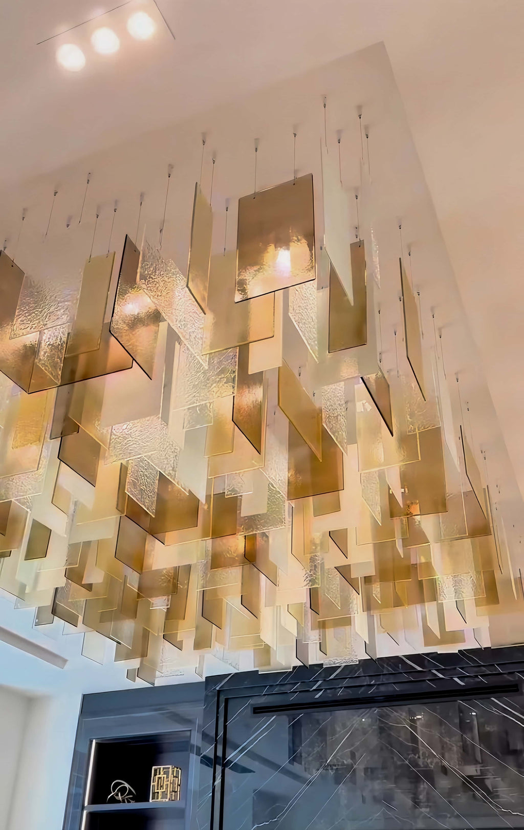 https://cdn.shopify.com/s/files/1/0554/8562/8591/files/modern_glass_chandelier.jpg?v=1773483270