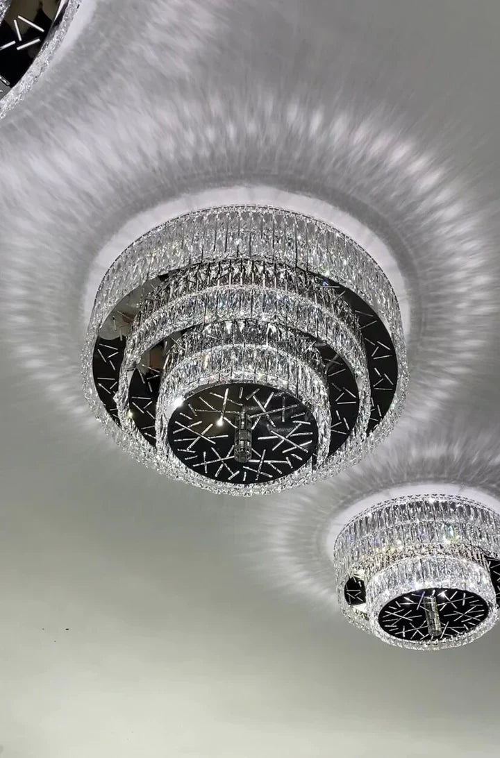 https://cdn.shopify.com/s/files/1/0736/8795/7790/files/oversized-modern-creative-flush-mount-round-multi-layers-crystal-pendant-chandelier-for-livingdining-roomhallway-merlin-lamps-4.webp?v=1765402419