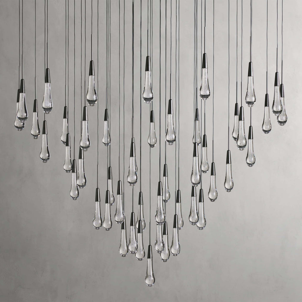 https://cdn.shopify.com/s/files/1/0736/8795/7790/files/solitaire-modern-17-24-36-58-round-chandelier-lighting-merlin-lamps-11.jpg?v=1765374446