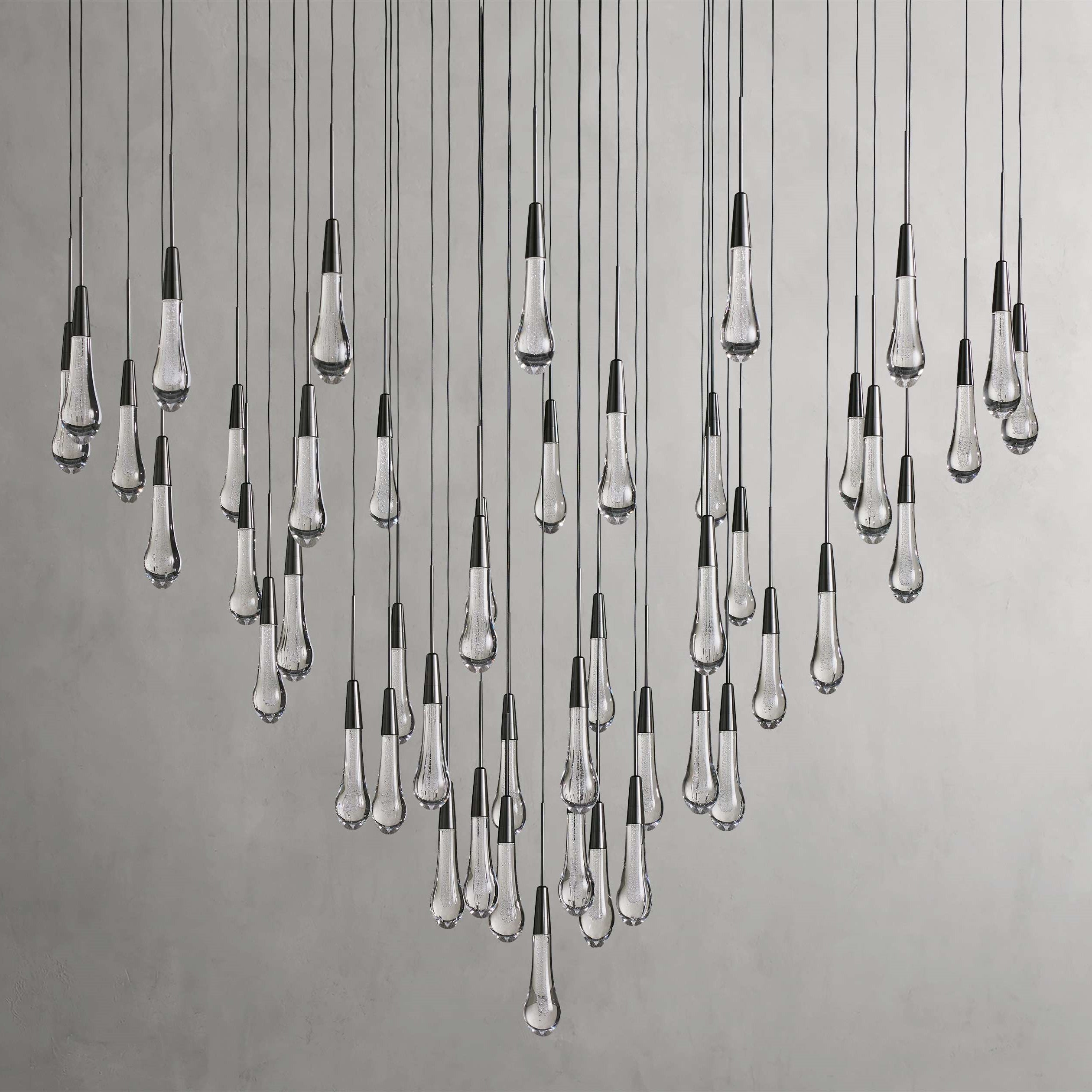 https://cdn.shopify.com/s/files/1/0736/8795/7790/files/solitaire-modern-17-24-36-58-round-chandelier-lighting-merlin-lamps-11.jpg?v=1765374446