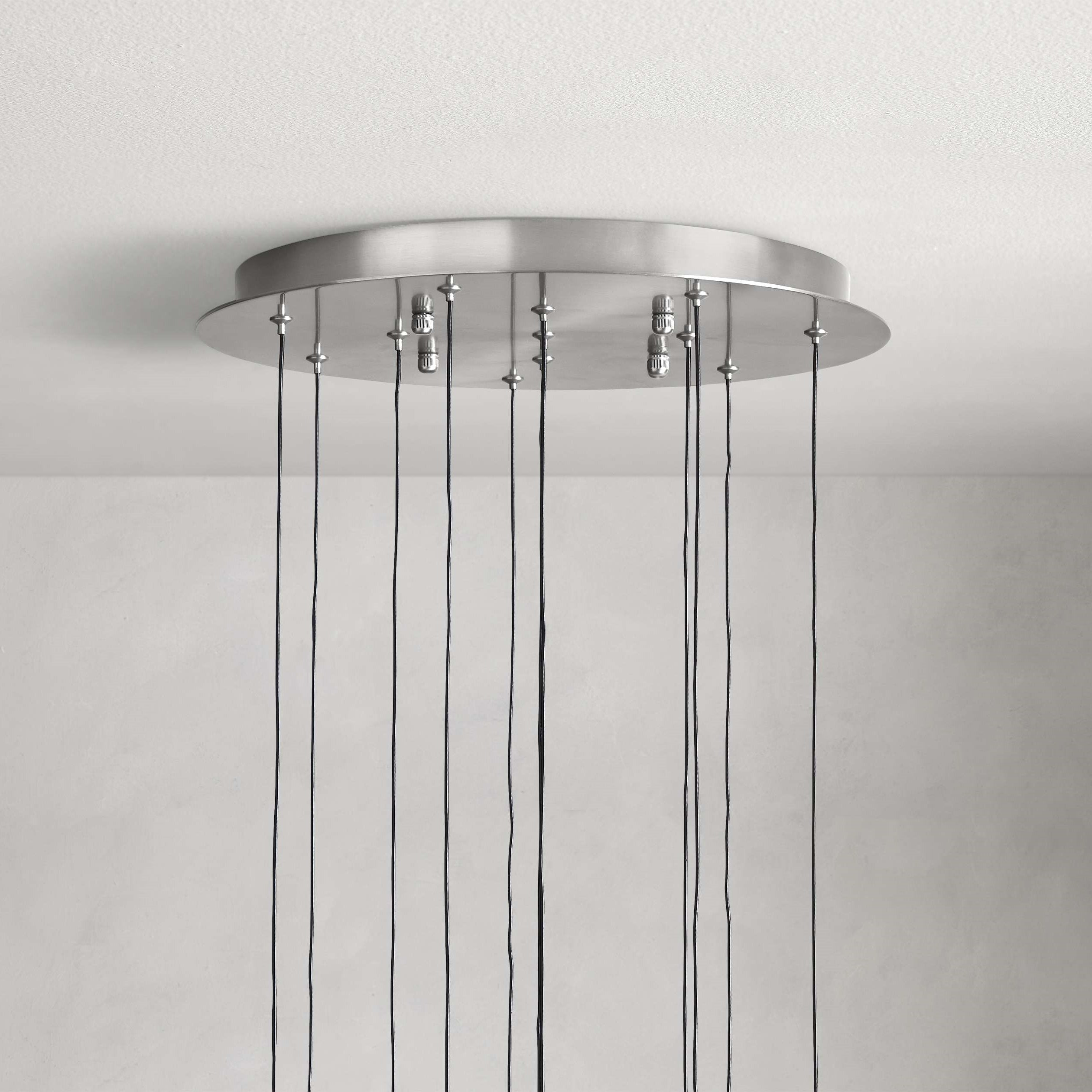 https://cdn.shopify.com/s/files/1/0736/8795/7790/files/solitaire-modern-17-24-36-58-round-chandelier-lighting-merlin-lamps-17.jpg?v=1765374456
