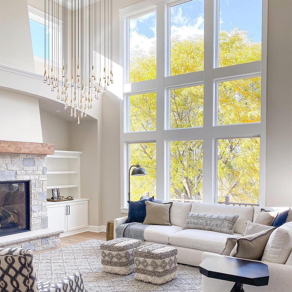 https://cdn.shopify.com/s/files/1/0736/8795/7790/files/solitaire-modern-17-24-36-58-round-chandelier-lighting-merlin-lamps-19.jpg?v=1765374459