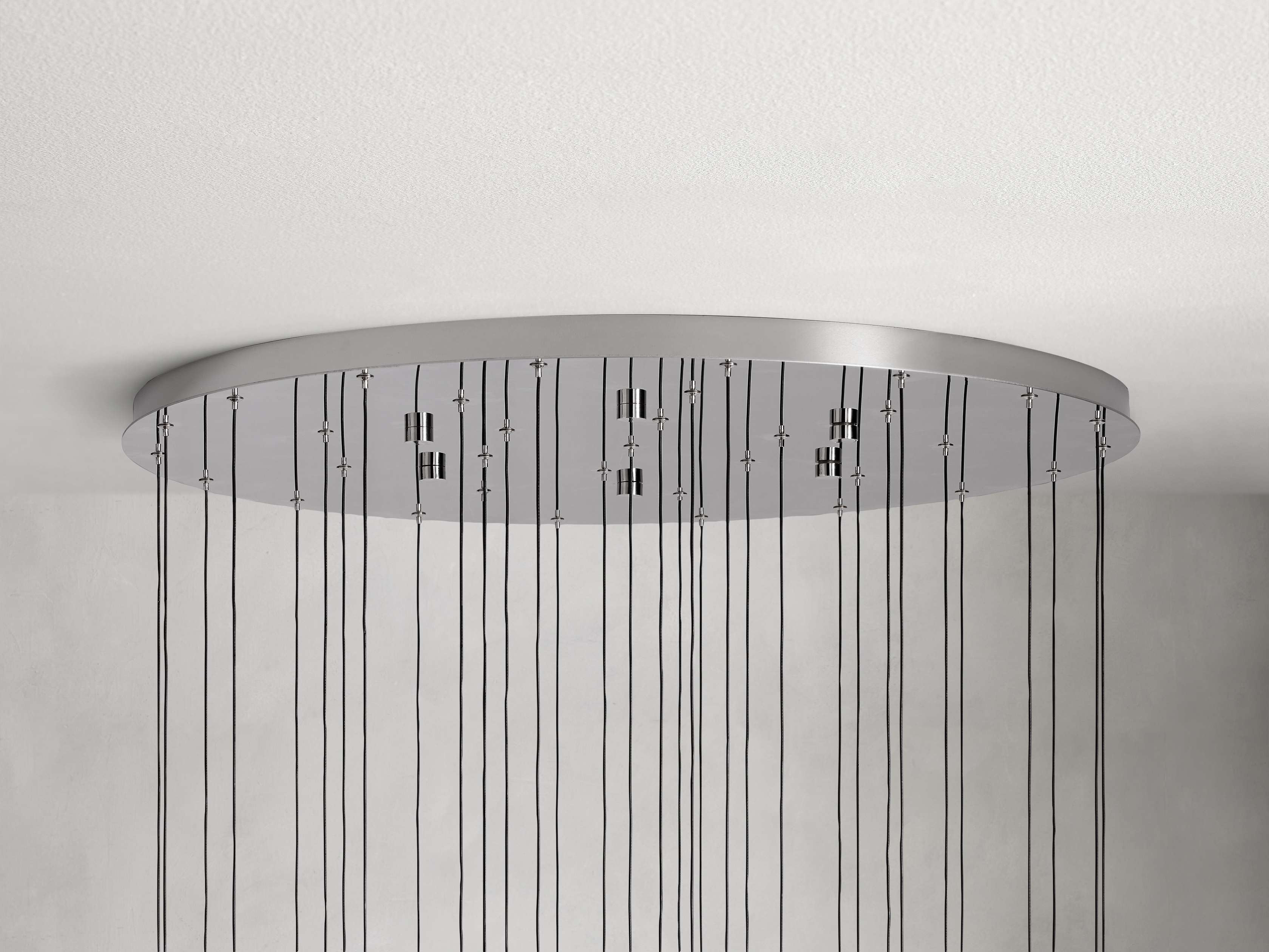 https://cdn.shopify.com/s/files/1/0736/8795/7790/files/solitaire-modern-17-24-36-58-round-chandelier-lighting-merlin-lamps-25.jpg?v=1765374470