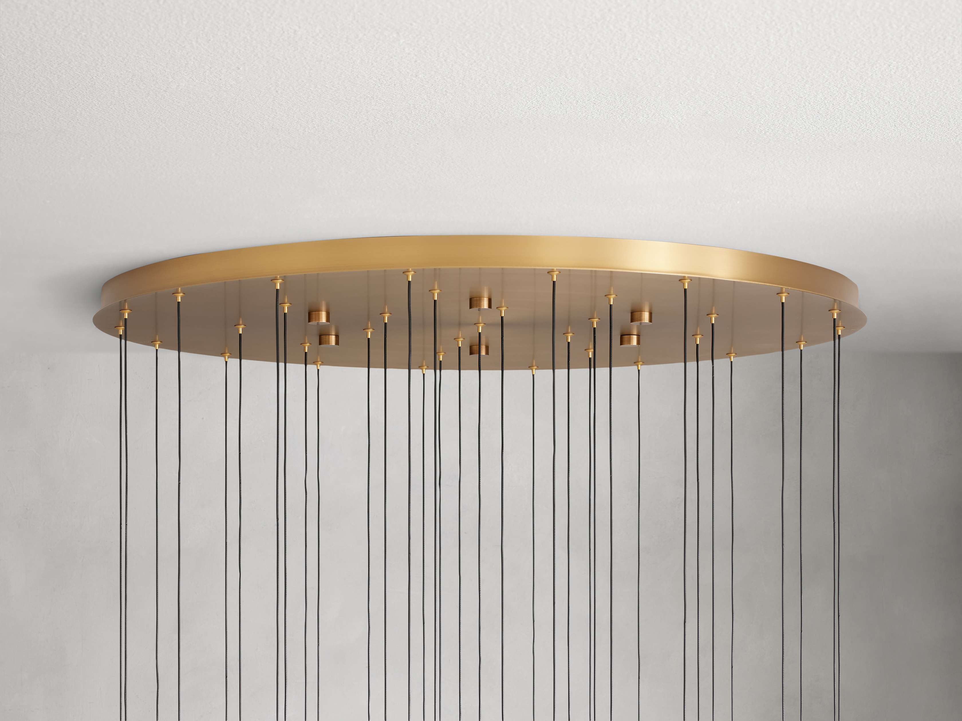 https://cdn.shopify.com/s/files/1/0736/8795/7790/files/solitaire-modern-17-24-36-58-round-chandelier-lighting-merlin-lamps-26.jpg?v=1765374472