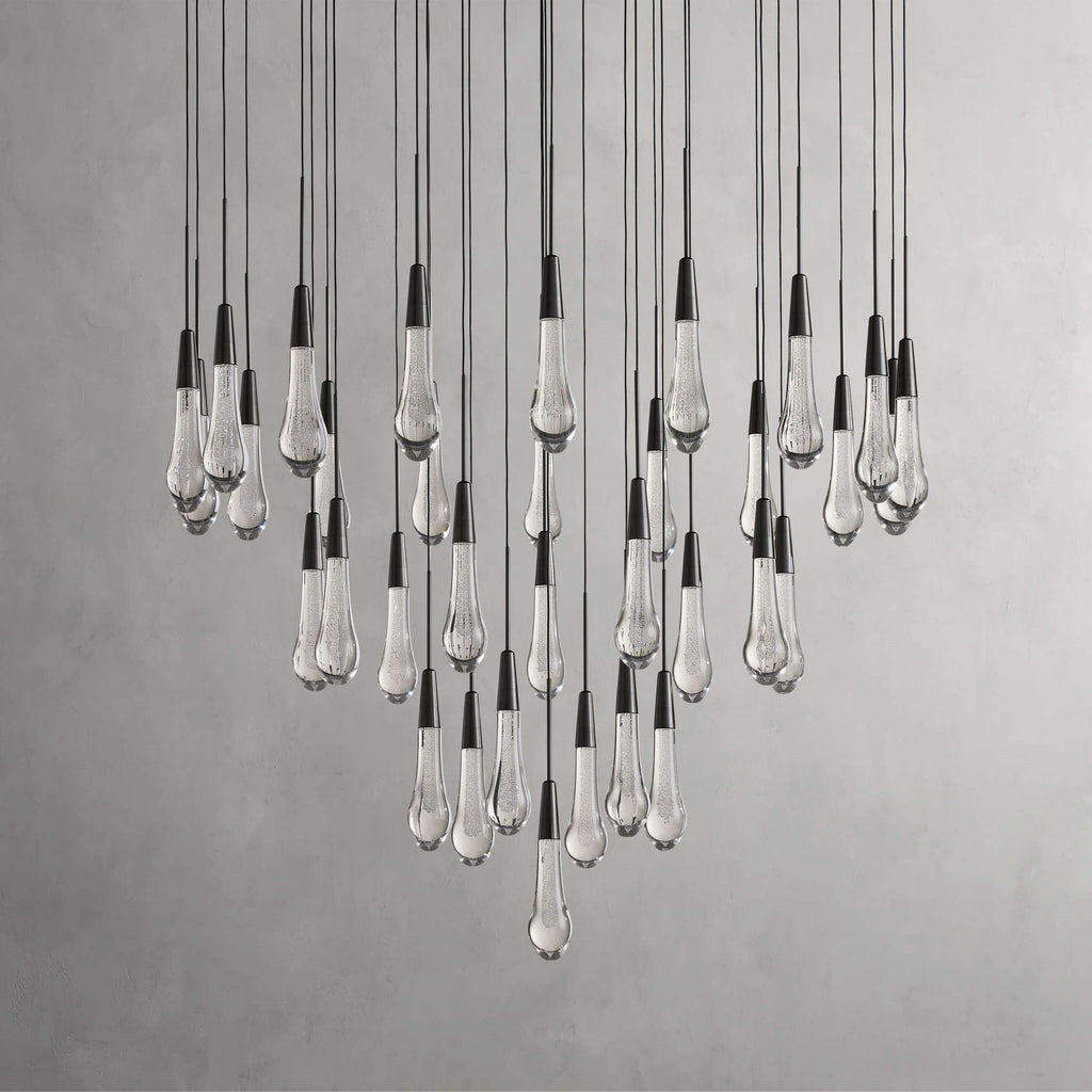 https://cdn.shopify.com/s/files/1/0736/8795/7790/files/solitaire-modern-17-24-36-58-round-chandelier-lighting-merlin-lamps-30.jpg?v=1765374481
