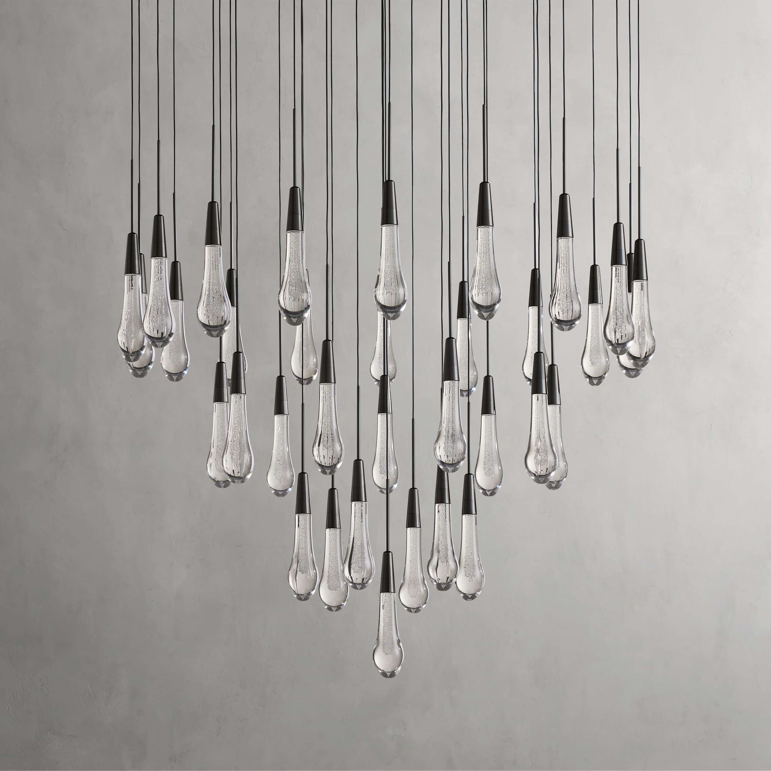 https://cdn.shopify.com/s/files/1/0736/8795/7790/files/solitaire-modern-17-24-36-58-round-chandelier-lighting-merlin-lamps-30.jpg?v=1765374481