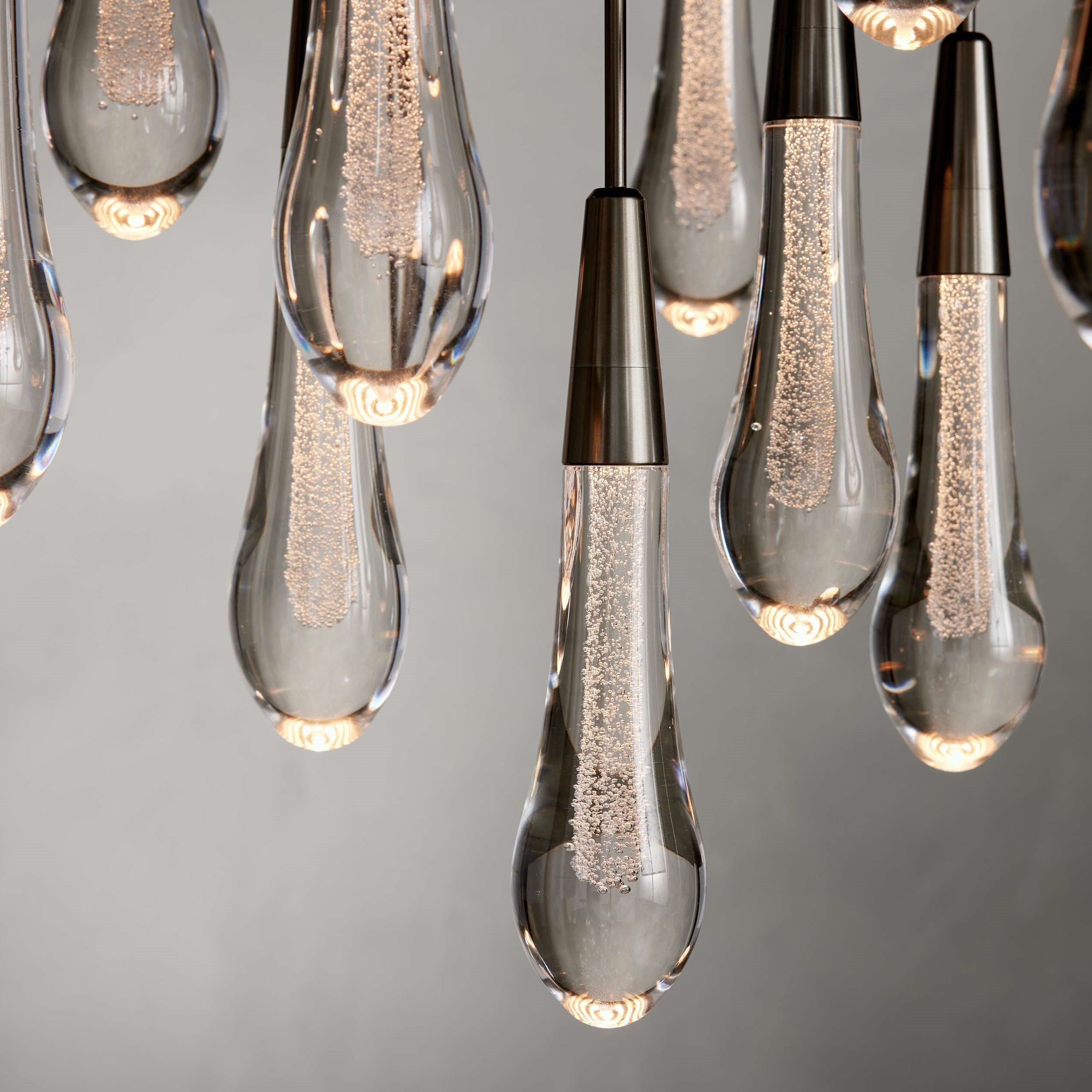 https://cdn.shopify.com/s/files/1/0736/8795/7790/files/solitaire-modern-17-24-36-58-round-chandelier-lighting-merlin-lamps-32.jpg?v=1765374485