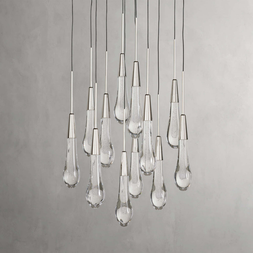 https://cdn.shopify.com/s/files/1/0736/8795/7790/files/solitaire-modern-17-24-36-58-round-chandelier-lighting-merlin-lamps-33.jpg?v=1765374487