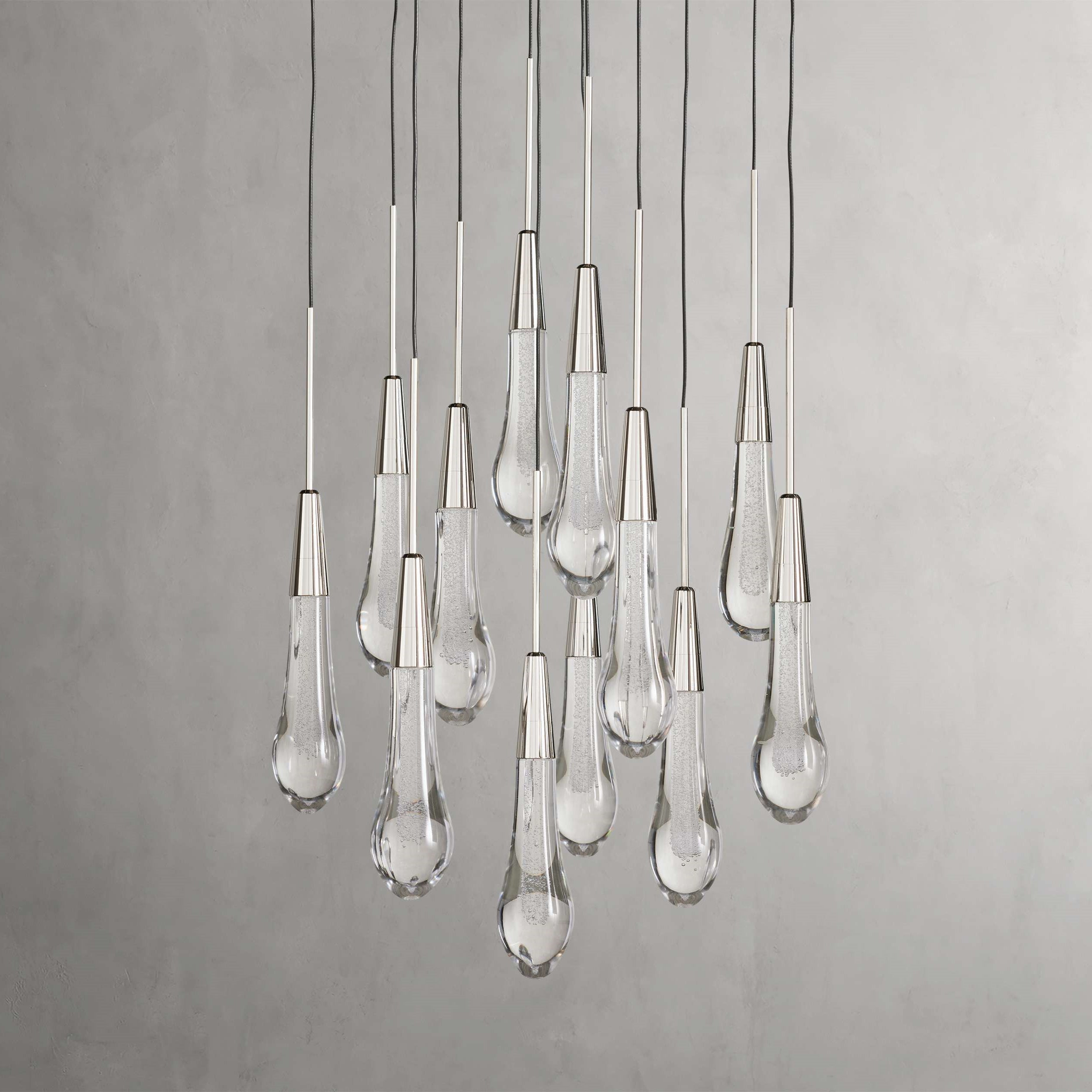 https://cdn.shopify.com/s/files/1/0736/8795/7790/files/solitaire-modern-17-24-36-58-round-chandelier-lighting-merlin-lamps-33.jpg?v=1765374487