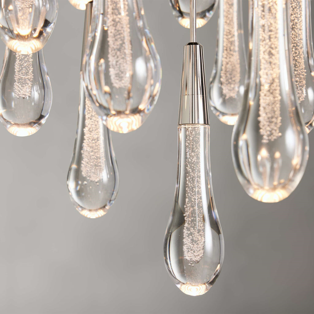 https://cdn.shopify.com/s/files/1/0736/8795/7790/files/solitaire-modern-17-24-36-58-round-chandelier-lighting-merlin-lamps-35.jpg?v=1765374492