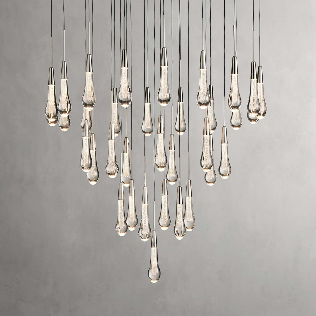 https://cdn.shopify.com/s/files/1/0736/8795/7790/files/solitaire-modern-17-24-36-58-round-chandelier-lighting-merlin-lamps-36.jpg?v=1765374494