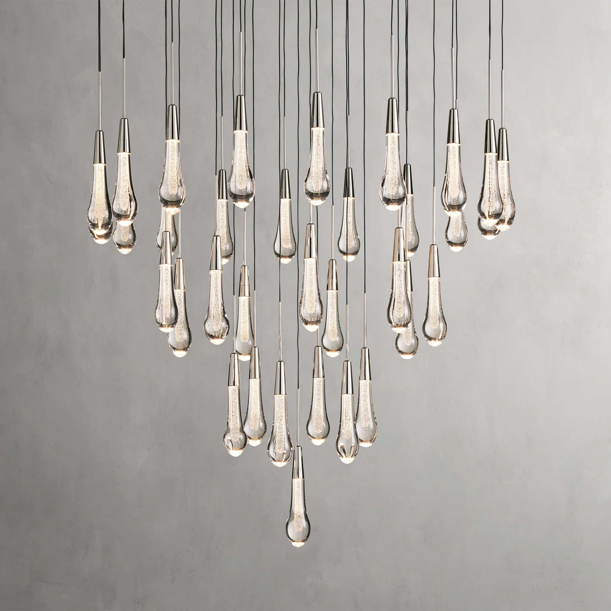 https://cdn.shopify.com/s/files/1/0736/8795/7790/files/solitaire-modern-17-24-36-58-round-chandelier-lighting-merlin-lamps-36.jpg?v=1765374494