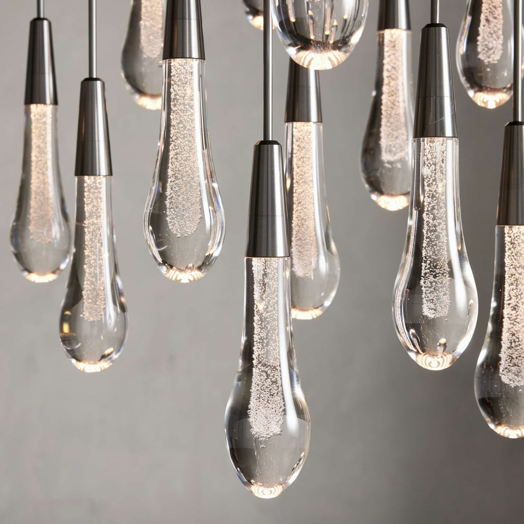 https://cdn.shopify.com/s/files/1/0736/8795/7790/files/solitaire-modern-17-24-36-58-round-chandelier-lighting-merlin-lamps-38.jpg?v=1765374499