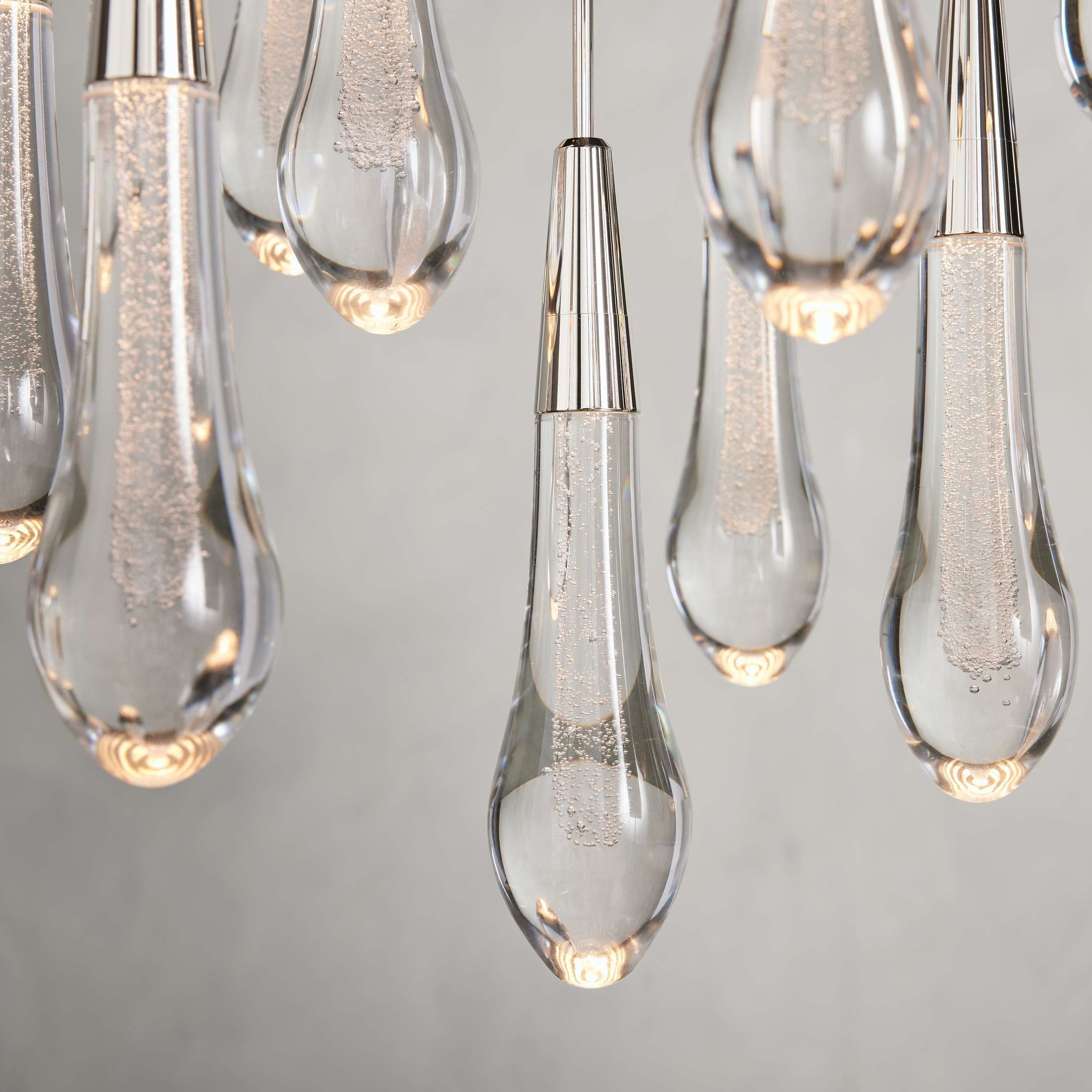 https://cdn.shopify.com/s/files/1/0736/8795/7790/files/solitaire-modern-17-24-36-58-round-chandelier-lighting-merlin-lamps-5.jpg?v=1765374434