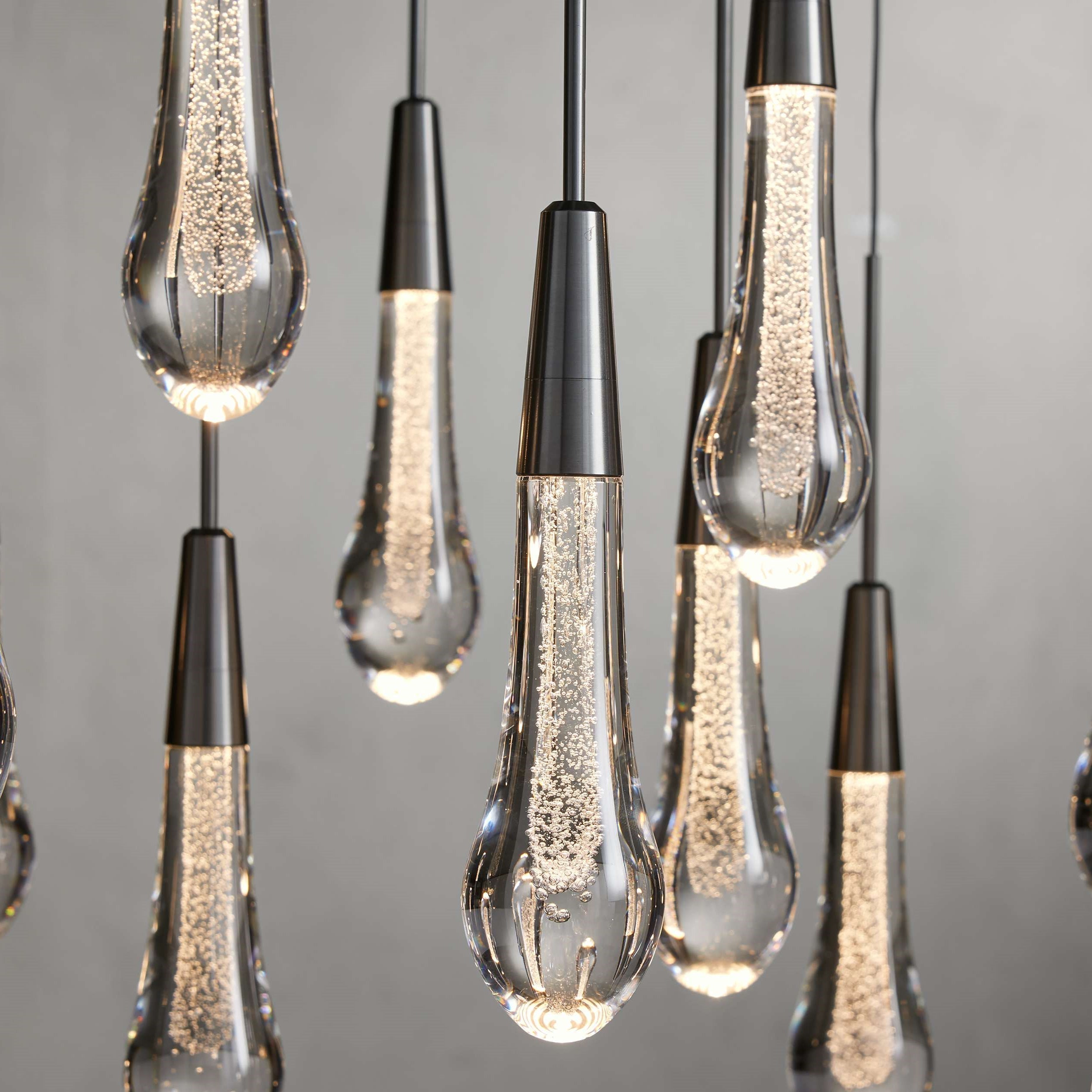 https://cdn.shopify.com/s/files/1/0736/8795/7790/files/solitaire-modern-17-24-36-58-round-chandelier-lighting-merlin-lamps-6.jpg?v=1765374436