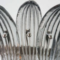 Close-up of clear ribbed glass leaves on the Murano Palmette chandelier.