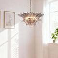 Pink glass chandelier hanging near a bright corner wall and window.